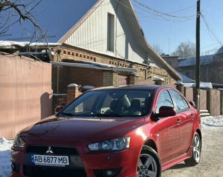 Красный Мицубиси Лансер, объемом двигателя 2 л и пробегом 119 тыс. км за 7300 $, фото 1 на Automoto.ua