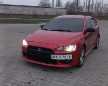 Красный Мицубиси Лансер, объемом двигателя 2 л и пробегом 200 тыс. км за 6000 $, фото 1 на Automoto.ua