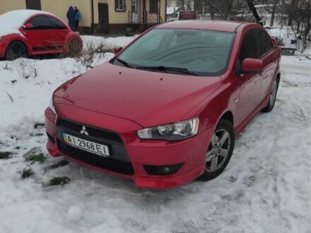 Червоний Міцубісі Lancer, об'ємом двигуна 2 л та пробігом 173 тис. км за 7200 $, фото 1 на Automoto.ua