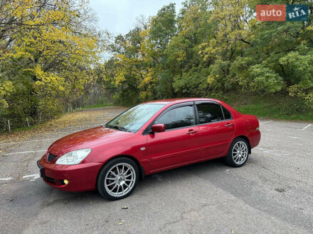 Красный Мицубиси Лансер, объемом двигателя 1.6 л и пробегом 192 тыс. км за 5999 $, фото 1 на Automoto.ua