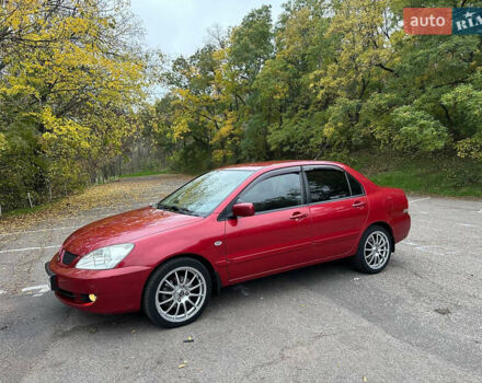 Червоний Міцубісі Lancer, об'ємом двигуна 1.6 л та пробігом 192 тис. км за 5999 $, фото 1 на Automoto.ua