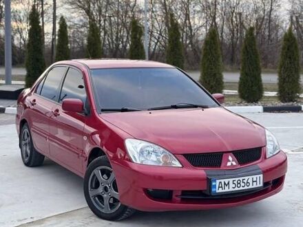 Красный Мицубиси Лансер, объемом двигателя 1.6 л и пробегом 276 тыс. км за 4550 $, фото 1 на Automoto.ua