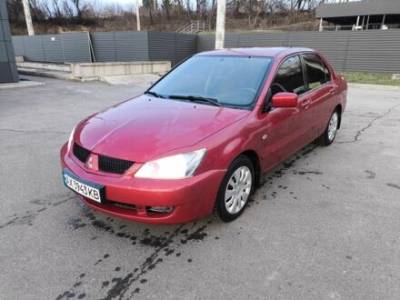 Красный Мицубиси Лансер, объемом двигателя 1.6 л и пробегом 140 тыс. км за 6000 $, фото 1 на Automoto.ua