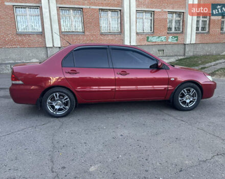 Красный Мицубиси Лансер, объемом двигателя 1.58 л и пробегом 260 тыс. км за 4600 $, фото 1 на Automoto.ua