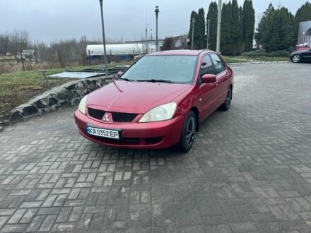 Красный Мицубиси Лансер, объемом двигателя 1.6 л и пробегом 265 тыс. км за 2956 $, фото 1 на Automoto.ua
