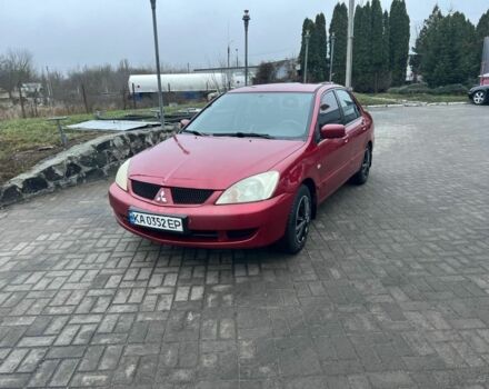 Красный Мицубиси Лансер, объемом двигателя 1.6 л и пробегом 265 тыс. км за 2956 $, фото 1 на Automoto.ua