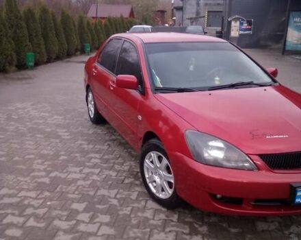 Красный Мицубиси Лансер, объемом двигателя 1.6 л и пробегом 191 тыс. км за 4900 $, фото 1 на Automoto.ua