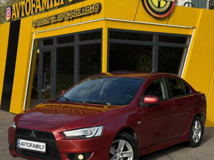 Красный Мицубиси Лансер, объемом двигателя 2 л и пробегом 215 тыс. км за 6500 $, фото 1 на Automoto.ua