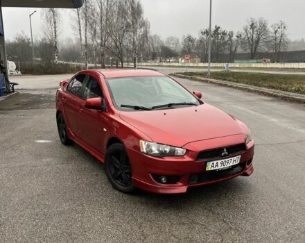 Красный Мицубиси Лансер, объемом двигателя 2 л и пробегом 223 тыс. км за 5800 $, фото 1 на Automoto.ua