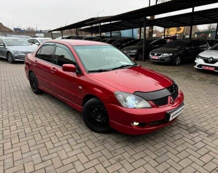 Красный Мицубиси Лансер, объемом двигателя 1.6 л и пробегом 215 тыс. км за 4500 $, фото 1 на Automoto.ua