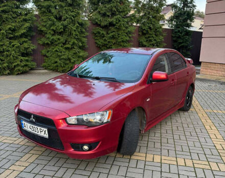 Червоний Міцубісі Lancer, об'ємом двигуна 2 л та пробігом 143 тис. км за 5200 $, фото 1 на Automoto.ua