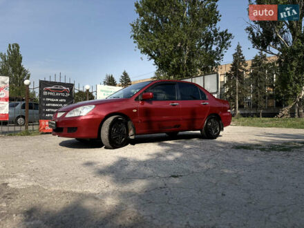 Червоний Міцубісі Lancer, об'ємом двигуна 1.58 л та пробігом 198 тис. км за 4900 $, фото 1 на Automoto.ua