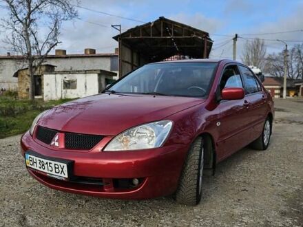 Червоний Міцубісі Lancer, об'ємом двигуна 1.6 л та пробігом 220 тис. км за 5800 $, фото 1 на Automoto.ua