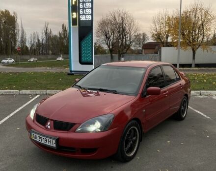 Червоний Міцубісі Lancer, об'ємом двигуна 1.6 л та пробігом 385 тис. км за 4500 $, фото 1 на Automoto.ua