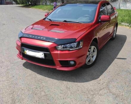 Червоний Міцубісі Lancer, об'ємом двигуна 2 л та пробігом 300 тис. км за 6500 $, фото 1 на Automoto.ua