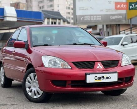 Красный Мицубиси Лансер, объемом двигателя 1.58 л и пробегом 223 тыс. км за 6400 $, фото 1 на Automoto.ua