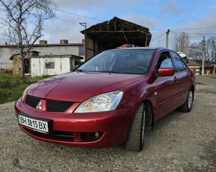 Красный Мицубиси Лансер, объемом двигателя 1.6 л и пробегом 223 тыс. км за 5400 $, фото 1 на Automoto.ua