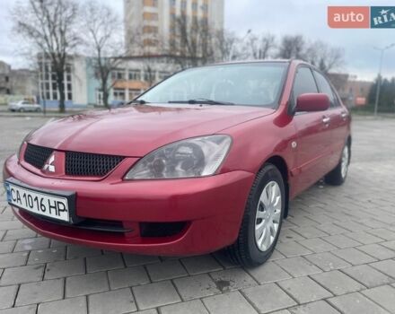 Красный Мицубиси Лансер, объемом двигателя 1.3 л и пробегом 222 тыс. км за 3700 $, фото 1 на Automoto.ua