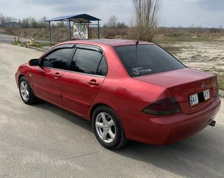 Красный Мицубиси Лансер, объемом двигателя 1.6 л и пробегом 330 тыс. км за 4600 $, фото 1 на Automoto.ua