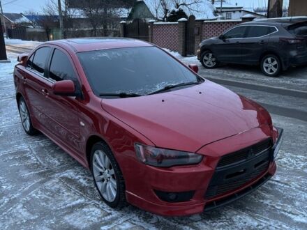 Червоний Міцубісі Lancer, об'ємом двигуна 2 л та пробігом 181 тис. км за 7750 $, фото 1 на Automoto.ua