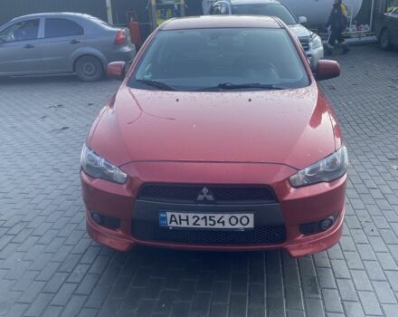 Красный Мицубиси Лансер, объемом двигателя 2 л и пробегом 200 тыс. км за 5350 $, фото 1 на Automoto.ua