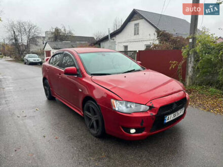 Красный Мицубиси Лансер, объемом двигателя 2 л и пробегом 246 тыс. км за 4900 $, фото 1 на Automoto.ua