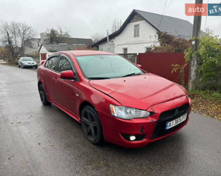 Красный Мицубиси Лансер, объемом двигателя 2 л и пробегом 246 тыс. км за 4900 $, фото 1 на Automoto.ua