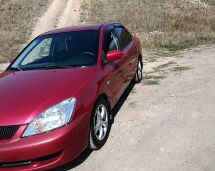 Червоний Міцубісі Lancer, об'ємом двигуна 1.6 л та пробігом 246 тис. км за 5500 $, фото 1 на Automoto.ua