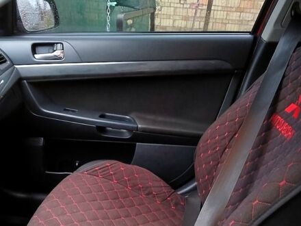 Червоний Міцубісі Lancer, об'ємом двигуна 2 л та пробігом 228 тис. км за 6500 $, фото 1 на Automoto.ua