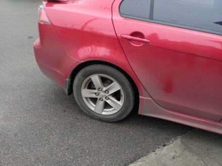 Червоний Міцубісі Lancer, об'ємом двигуна 2 л та пробігом 250 тис. км за 6500 $, фото 1 на Automoto.ua