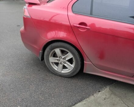 Красный Мицубиси Лансер, объемом двигателя 2 л и пробегом 250 тыс. км за 6500 $, фото 1 на Automoto.ua