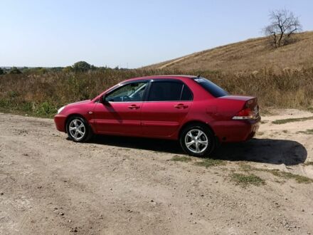 Міцубісі Lancer 2009 у Краматорске на Automoto.ua Червоний Міцубісі Lancer, об'ємом двигуна 1.6 л та пробігом 246 тис. км за 5500 $, фото 1 на Automoto.ua