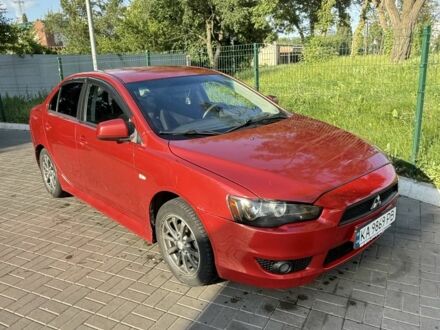 Красный Мицубиси Лансер, объемом двигателя 2 л и пробегом 215 тыс. км за 5999 $, фото 1 на Automoto.ua