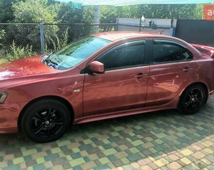 Червоний Міцубісі Lancer, об'ємом двигуна 2 л та пробігом 173 тис. км за 6900 $, фото 1 на Automoto.ua