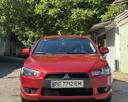 Червоний Міцубісі Lancer, об'ємом двигуна 2 л та пробігом 128 тис. км за 8200 $, фото 1 на Automoto.ua