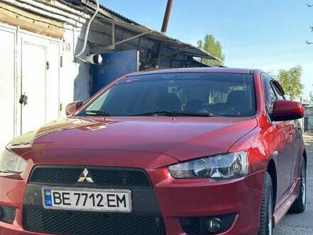 Червоний Міцубісі Lancer, об'ємом двигуна 2 л та пробігом 111 тис. км за 9700 $, фото 1 на Automoto.ua