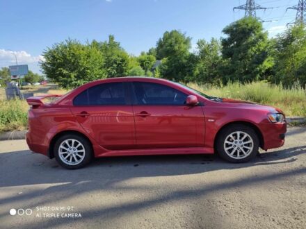 Червоний Міцубісі Lancer, об'ємом двигуна 2 л та пробігом 146 тис. км за 9000 $, фото 1 на Automoto.ua