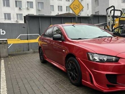 Красный Мицубиси Лансер, объемом двигателя 2 л и пробегом 230 тыс. км за 6700 $, фото 1 на Automoto.ua