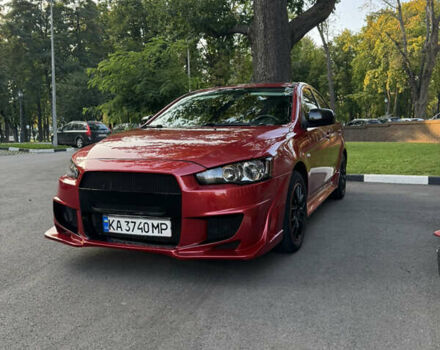 Червоний Міцубісі Lancer, об'ємом двигуна 2 л та пробігом 260 тис. км за 6900 $, фото 1 на Automoto.ua