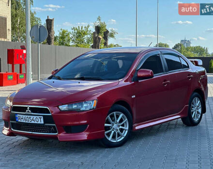 Червоний Міцубісі Lancer, об'ємом двигуна 2 л та пробігом 185 тис. км за 8700 $, фото 1 на Automoto.ua