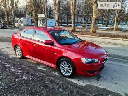 Червоний Міцубісі Lancer, об'ємом двигуна 2 л та пробігом 108 тис. км за 9300 $, фото 1 на Automoto.ua