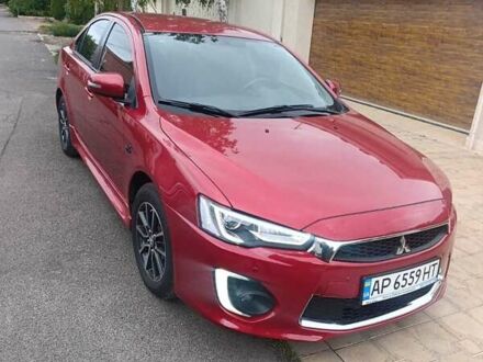 Красный Мицубиси Лансер, объемом двигателя 2 л и пробегом 56 тыс. км за 12500 $, фото 1 на Automoto.ua
