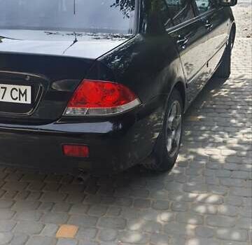 Мицубиси Лансер, объемом двигателя 1.58 л и пробегом 220 тыс. км за 4200 $, фото 6 на Automoto.ua