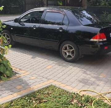 Мицубиси Лансер, объемом двигателя 1.58 л и пробегом 220 тыс. км за 4200 $, фото 4 на Automoto.ua