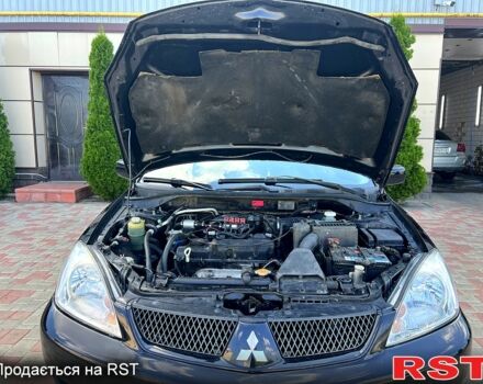 Мицубиси Лансер, объемом двигателя 1.6 л и пробегом 243 тыс. км за 4800 $, фото 7 на Automoto.ua