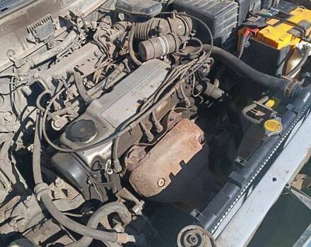 Жовтий Міцубісі Lancer, об'ємом двигуна 1.3 л та пробігом 306 тис. км за 1500 $, фото 14 на Automoto.ua