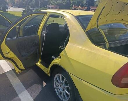 Жовтий Міцубісі Lancer, об'ємом двигуна 1.3 л та пробігом 306 тис. км за 1500 $, фото 6 на Automoto.ua