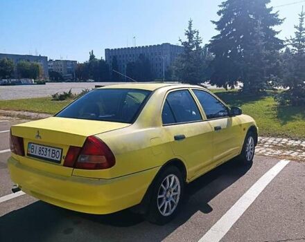 Жовтий Міцубісі Lancer, об'ємом двигуна 1.3 л та пробігом 306 тис. км за 1500 $, фото 4 на Automoto.ua