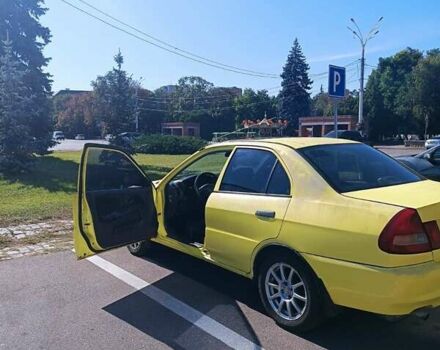 Жовтий Міцубісі Lancer, об'ємом двигуна 1.3 л та пробігом 306 тис. км за 1500 $, фото 3 на Automoto.ua