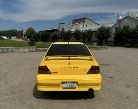 Жовтий Міцубісі Lancer, об'ємом двигуна 2 л та пробігом 262 тис. км за 3300 $, фото 2 на Automoto.ua